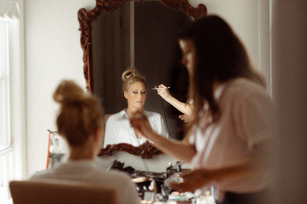 bride getting her makeup done