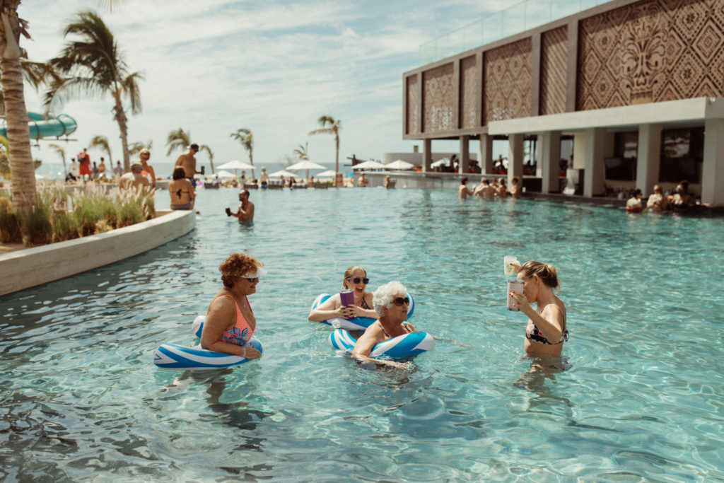 Booking their destination wedding photographer for the entire weekend meant this couple got photos of their pool party!