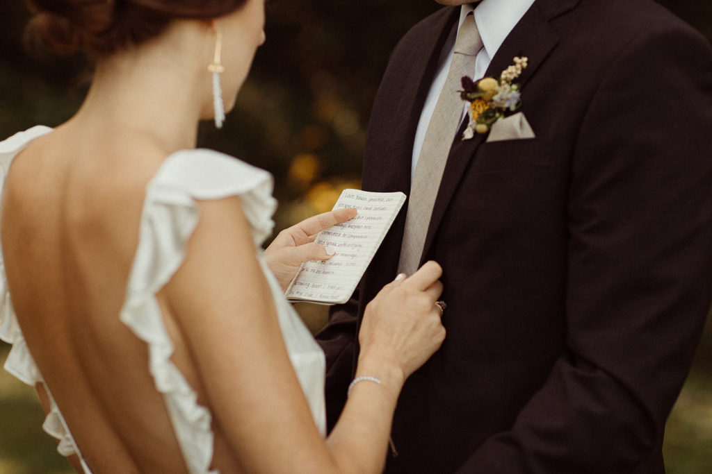 Bride and groom exchange their personal wedding vows to make their wedding ceremony unique.