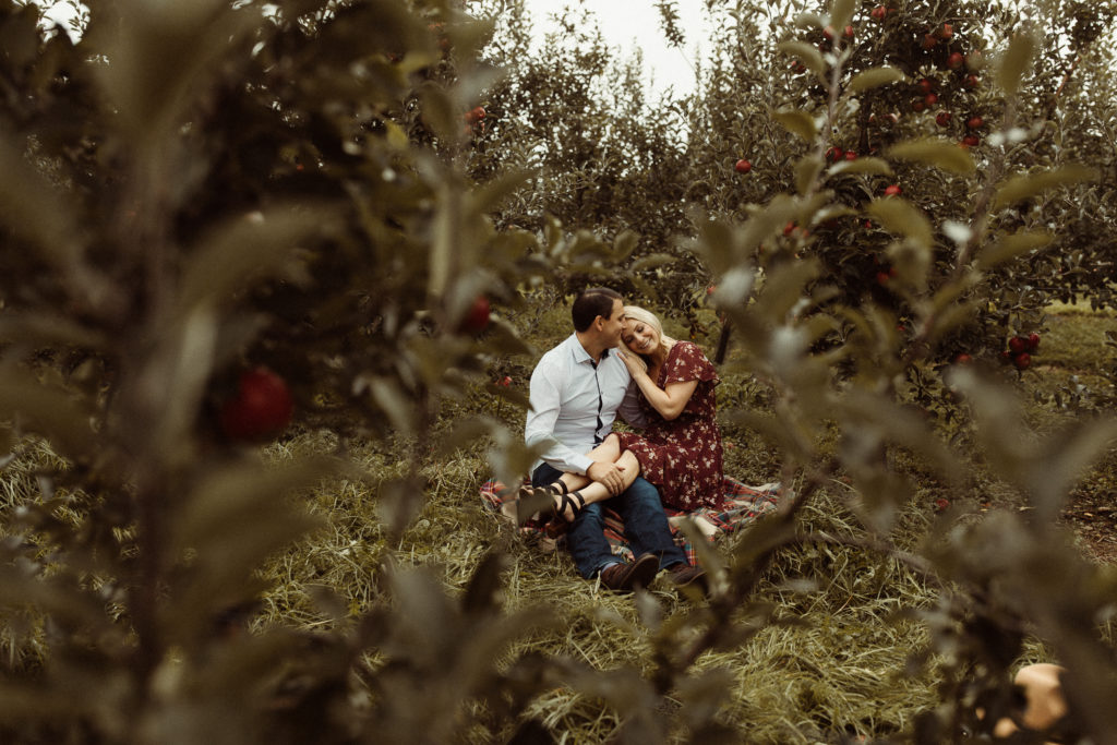 A couple takes their engagement photos at one of their favorite places, Beak and Skiff, to make their session unique.