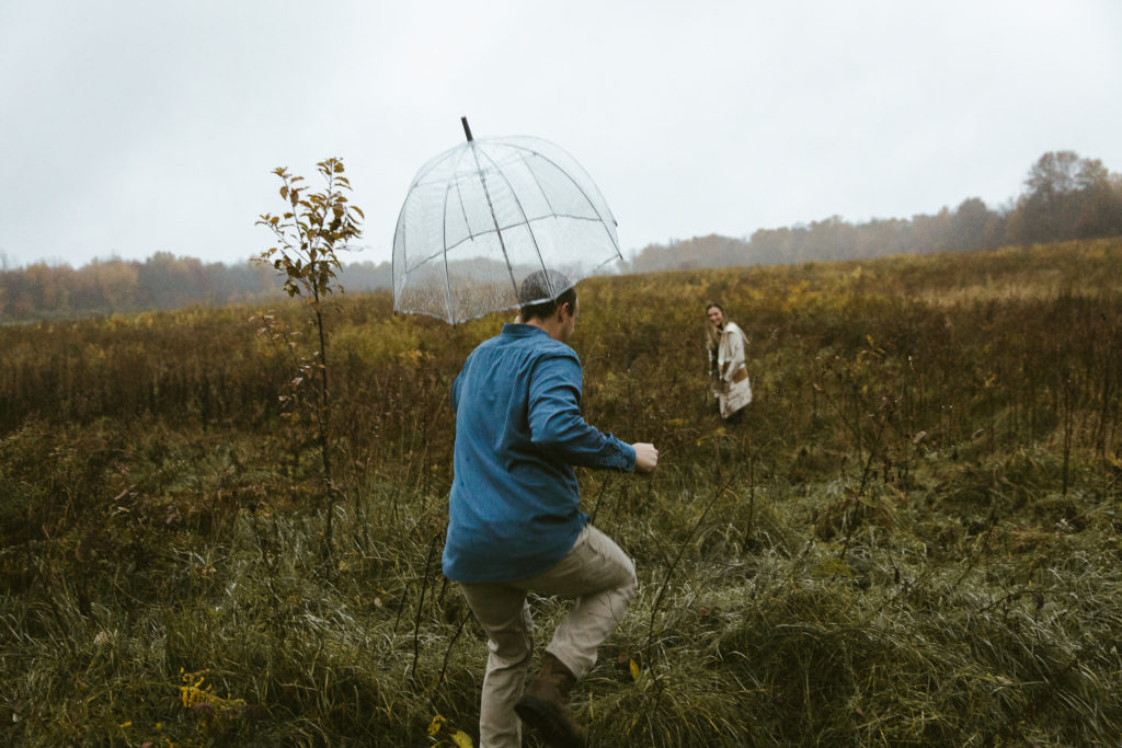 An engagement shoot taken on a rainy day makes for unique photos.