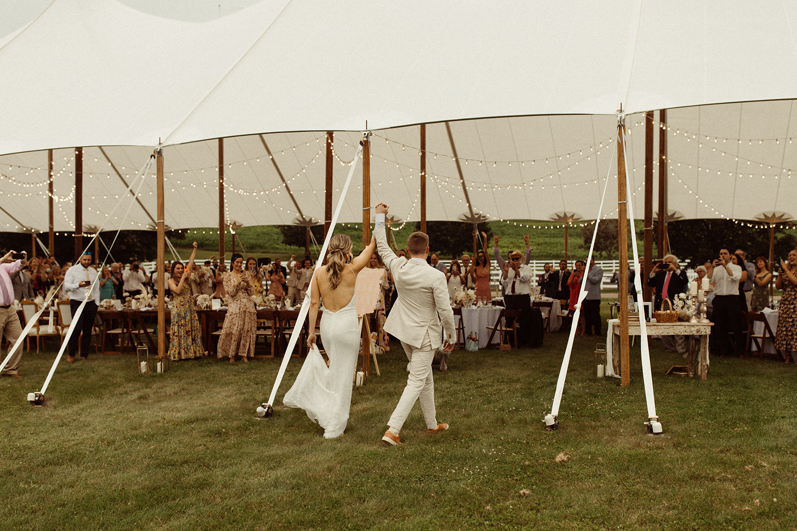 A couple walks into their unique wedding reception at Hobbit Hollow in Skaneateles, NY.