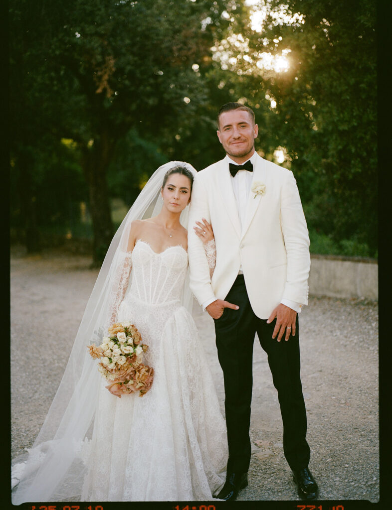 A film photograph of a couple at their luxury wedding, at Villa Corsini in Italy.